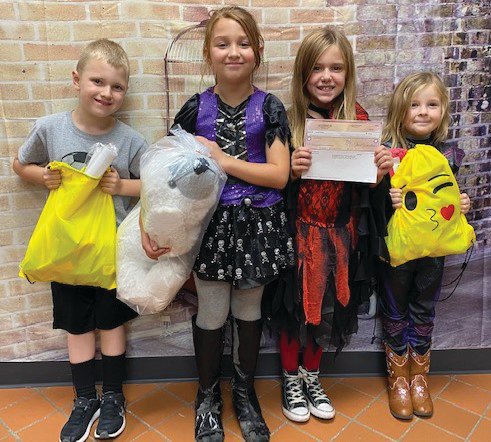 Turkey Run Elementary recently recognized the top salesmen from the trash bag sales fundraiser. Kyndal Gordon was the top salesman. She received a check of $50.  Tanner Earley was second and earned a prize bag. Eva Johnson was third and won an emoji prize bag. Hope Jeffers received a large stuffed animal for being the fourth top salesman. Pictured are Earley, Jeffers, Gordon and Johnson.